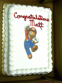 Close up of cake as Super Mario joins in the celebration (a bit of a video game addict Matt is...)